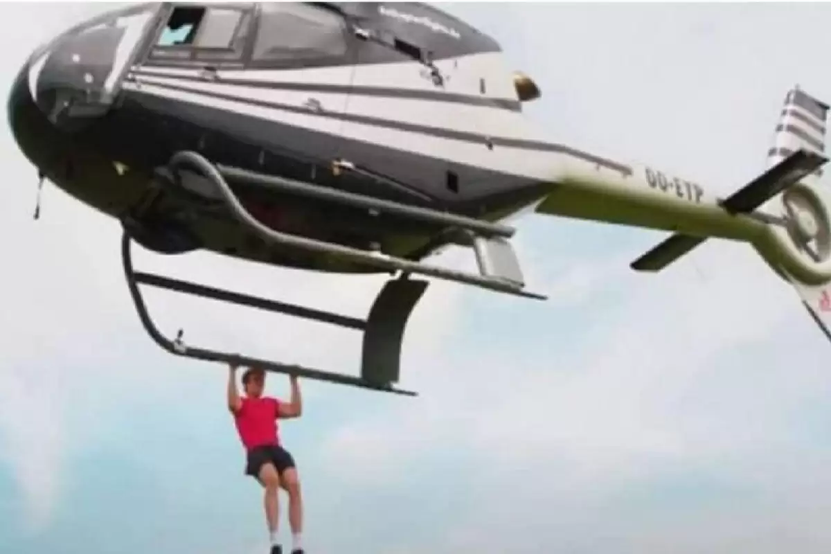 (ویدئو)  شکستن رکورد عجیب گینس با بارفیکس روی هلی‌کوپتر